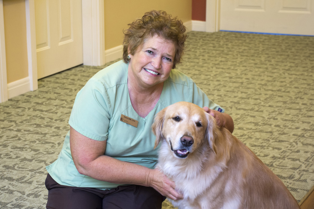 professional photograph at Kenwood Retirement community of nurse with dog by Dan Cleary of Cleary Creative Photography in Dayton Ohio
